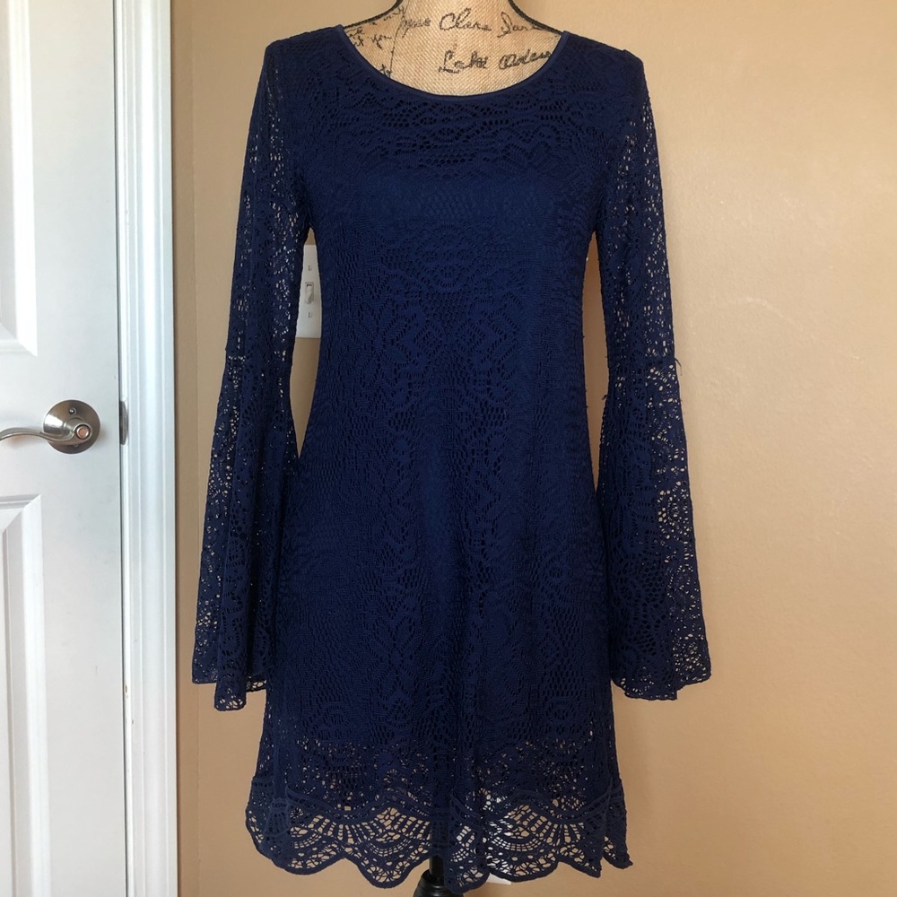 Long bell sleeved navy blue laced dress.